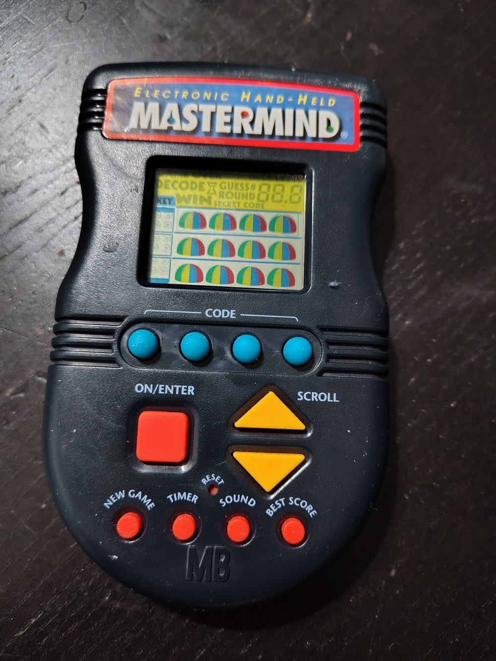 Hasbro Mastermind Handheld Game - Black with Blue, Red & Yellow Buttons